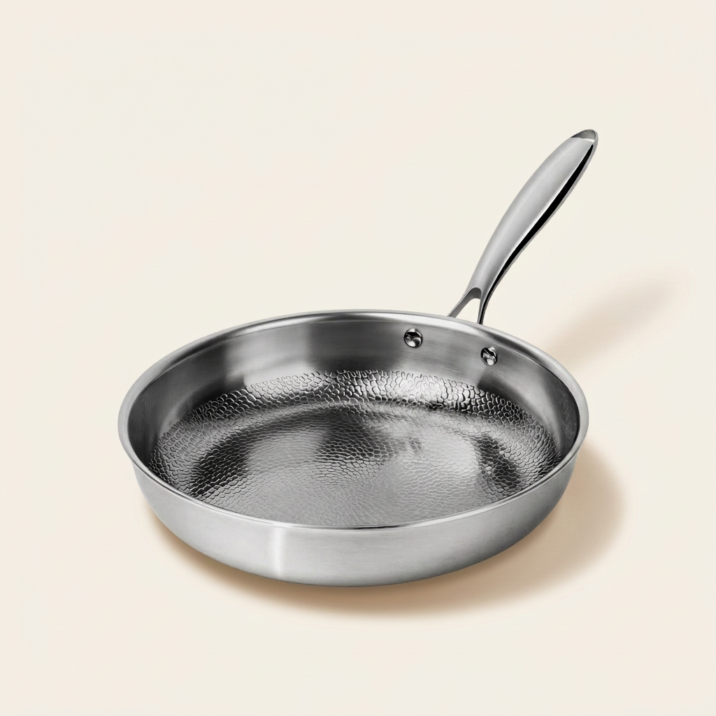 Titanium Hammered Pan Pro Standard on warm linen background