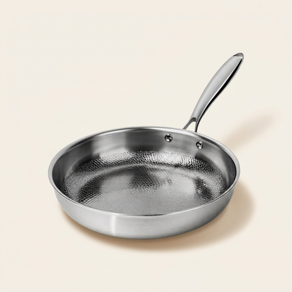 Titanium Hammered Pan Pro Standard on warm linen background